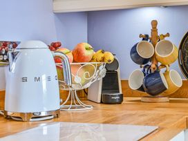 A kitchen with a kettle and coffee machine at Muntham Apartment 4 in Torquay