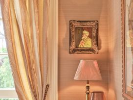 A lamp and painting displayed on the wall at Muntham Apartment 6 in Torquay