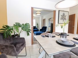A dining room with a table and chairs at Manor Park View Norwich