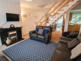 A living room with a sofa and television at Cromer Holiday Home in Cromer
