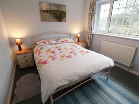 A bedroom with a bed and bedside tables at Cromer Holiday Home in Cromer