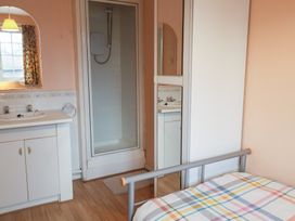 A bathroom with a shower and sink at Cromer Holiday Home in Cromer