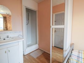 A bathroom with a shower and sink at Cromer Holiday Home in Cromer