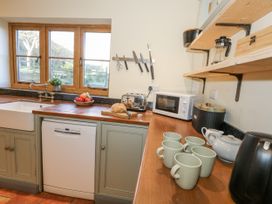A kitchen with a sink and countertop appliances at Honeysuckle Cottage Smallridge Nr. Axminster
