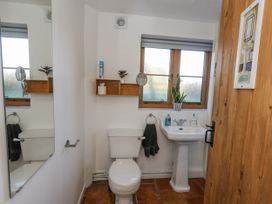 A bathroom with a sink and toilet at Honeysuckle Cottage Smallridge Nr. Axminster