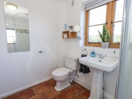 A bathroom with a sink and toilet at Honeysuckle Cottage Smallridge Nr. Axminster