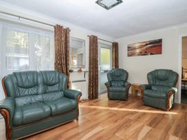 A living room with two armchairs and a sofa at Willow Lodge near Liskeard