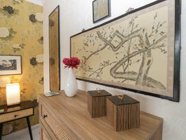 A hallway with wall art and decorative items at Apple Byrd in Kendal