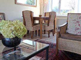 A dining room with a table and chairs at Apple Byrd in Kendal