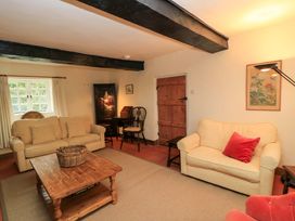 A living room with sofas and a coffee table at Plush Cottage in Plush