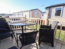 An outdoor seating area with a table and chairs at The Pad in 