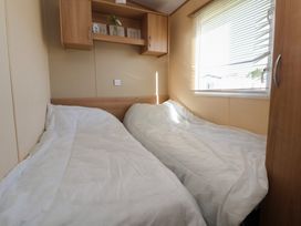 A bedroom with two beds and a window at The Pad in 
