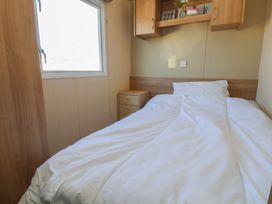 A bedroom with a bed and window at The Pad 