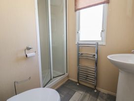 A bathroom with a shower and sink at The Pad in 