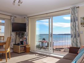 A living room with a view of the beach at Beachside