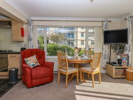 A dining room with a table and chairs at Beachside