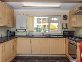 A kitchen with cabinets and appliances at Beachside