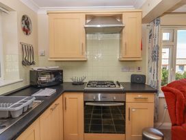 A kitchen with stove and microwave at Beachside