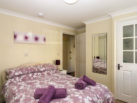 A bedroom with a bed and towels at Beachside