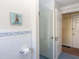 A bathroom with a towel holder and shower at Beachside