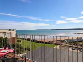 A balcony overlooking the ocean at Beachside