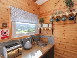A kitchen with a stainless steel toaster and kettle at Sychnant Farm Retreat Llanedi near Pontarddulais