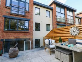 An outdoor area with furniture and a fence at Harbour Heights in Weymouth