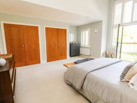 A bedroom with a bed and wardrobe at Harbour Heights in Weymouth
