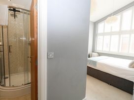 A bedroom with a shower and bed at Harbour Heights in Weymouth