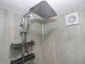 A shower with a rain showerhead at Park View Studio in Ambleside