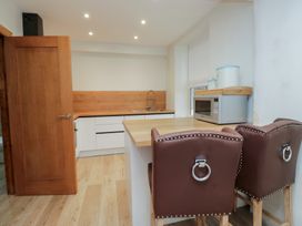 A kitchen with a sink and microwave at Park View in Ambleside