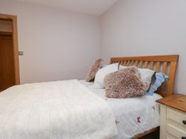 A bedroom with a bed and bedside table at Park View in Ambleside