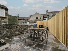 An outdoor dining area with a table and chairs at Park View in Ambleside