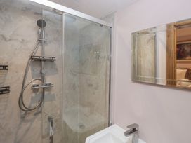 A bathroom with a shower and sink at Park View, Ambleside