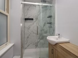 A bathroom with a shower and basin at Park View in Ambleside