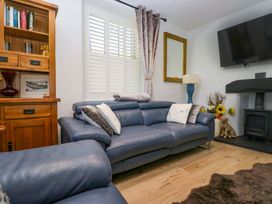 A living room with a sofa and TV at Park View in Ambleside