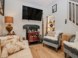 A living room with a fireplace and television at Park View in Ambleside