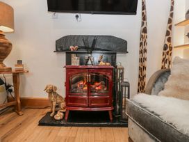 A living room with fireplace and television at Park View in Ambleside
