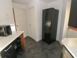 A kitchen with a refrigerator and air fryer at 9 Ffordd Donaldson, Swansea