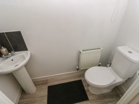 A bathroom with a sink and toilet at Swansea Escape in Swansea