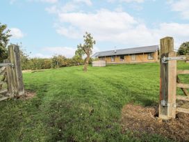 An outdoor area with a building and a tree at Pear Trees Bewdley