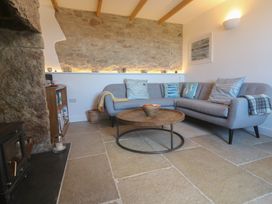 A living room with a sofa and coffee table at 12 Boswedden Terrace St Just