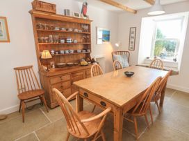 A dining room with a table and chairs at 12 Boswedden Terrace St Just