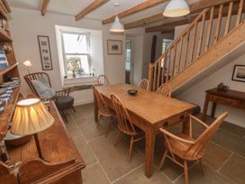 A dining room with a table and chairs at 12 Boswedden Terrace in St Just