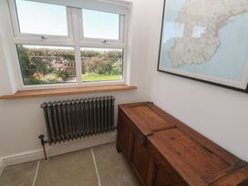 A room with a window and a wooden chest at 12 Boswedden Terrace in St Just