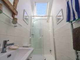A bathroom with a shower and sink at 12 Boswedden Terrace St Just