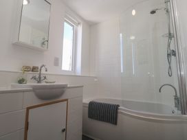 A bathroom with a sink and shower at 12 Boswedden Terrace in St Just