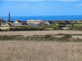 A view of houses and ocean in the distance at 12 Boswedden Terrace St Just