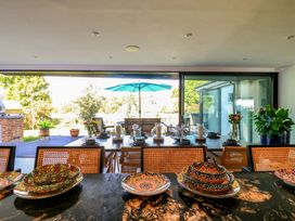 A dining area with a view of the garden at Manor Farm House in Merton near Bicester