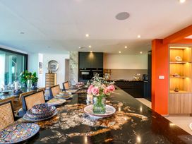 A kitchen with a countertop and floral arrangement at Manor Farm House in Merton near Bicester